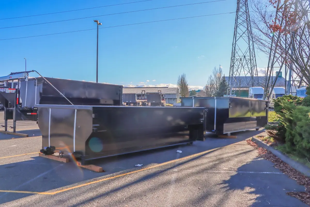 Roll-off dumpster ready for waste disposal at job site for Roofing Dumpster Rental in Winterville
